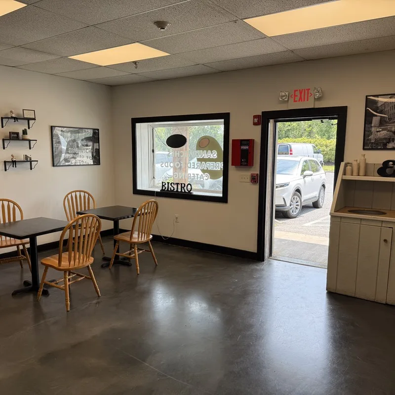 Bistro seating area inside Delishh in Sagamore Beach