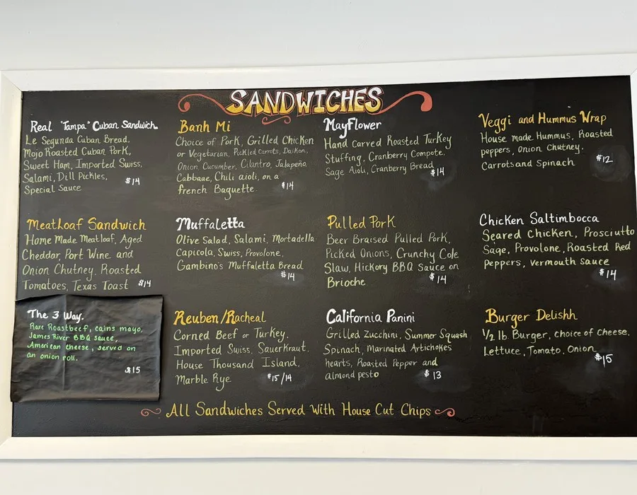 Delishh's hand-painted sandwich menu board